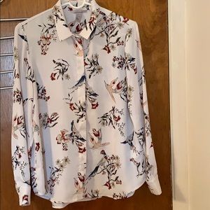 An HM shirt with flower and bird pattern